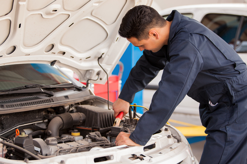 Using jumper cables to start a car